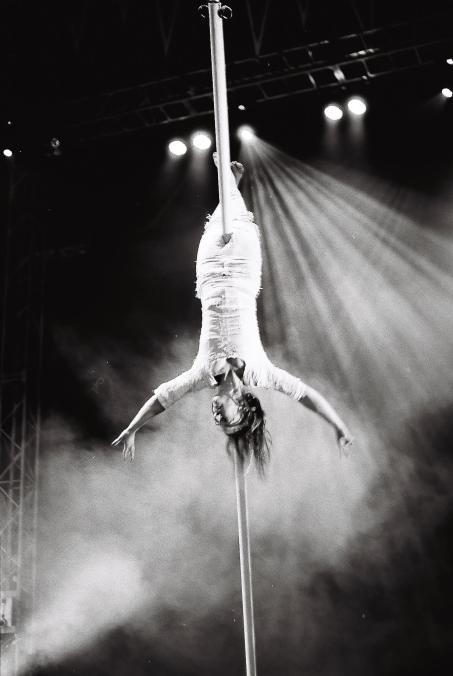 Laura Moy. photographer Eleanor Woodruff . flying pole . from FLOWN. at Glastonbury festival